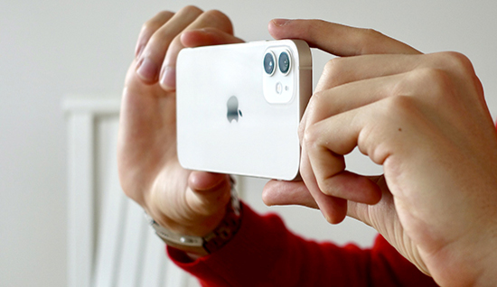 An iphone held between two hands